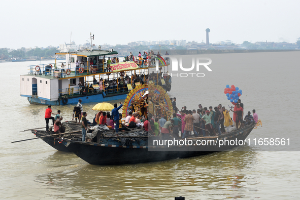 Maharaja Naba Krishna starts Durga Puja in 1757 at Sovabazar Royal Palace. An idol of Goddess Durga is seen being uploaded onto two boat mid...