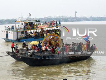 Maharaja Naba Krishna starts Durga Puja in 1757 at Sovabazar Royal Palace. An idol of Goddess Durga is seen being uploaded onto two boat mid...