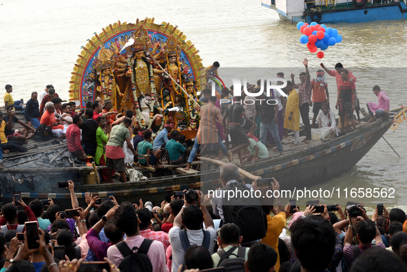 Maharaja Naba Krishna starts Durga Puja in 1757 at Sovabazar Royal Palace. An idol of Goddess Durga is seen being uploaded onto two boat mid...