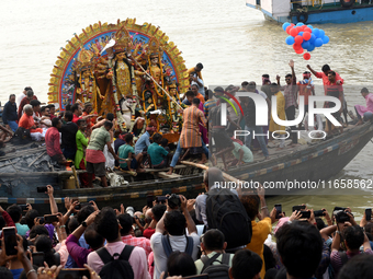 Maharaja Naba Krishna starts Durga Puja in 1757 at Sovabazar Royal Palace. An idol of Goddess Durga is seen being uploaded onto two boat mid...