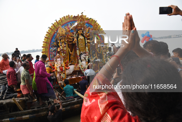 Maharaja Naba Krishna starts Durga Puja in 1757 at Sovabazar Royal Palace. An idol of Goddess Durga is seen being uploaded onto two boat mid...