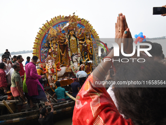 Maharaja Naba Krishna starts Durga Puja in 1757 at Sovabazar Royal Palace. An idol of Goddess Durga is seen being uploaded onto two boat mid...