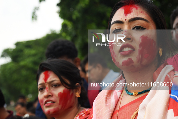 Hindu devotees cry during the immersion of the idol of Hindu goddess Durga on the banks of the river Ganges in Kolkata, India, on October 12...