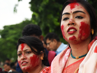 Hindu devotees cry during the immersion of the idol of Hindu goddess Durga on the banks of the river Ganges in Kolkata, India, on October 12...