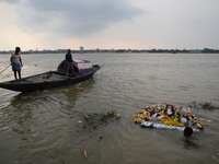 Hindu devotees immerse clay idols of Goddess Durga in the River Ganges in Kolkata, India, on October 12, 2024. The ten-day-long Hindu festiv...