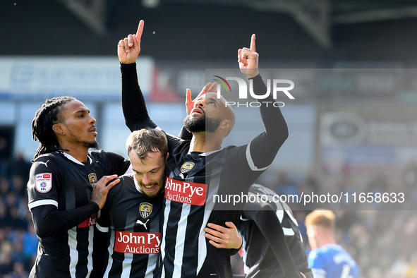 David McGoldrick of Notts County celebrates after scoring from the penalty spot to make it 2-2 during the Sky Bet League 2 match between Che...