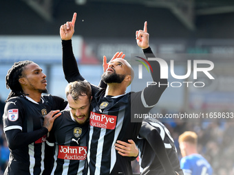 David McGoldrick of Notts County celebrates after scoring from the penalty spot to make it 2-2 during the Sky Bet League 2 match between Che...