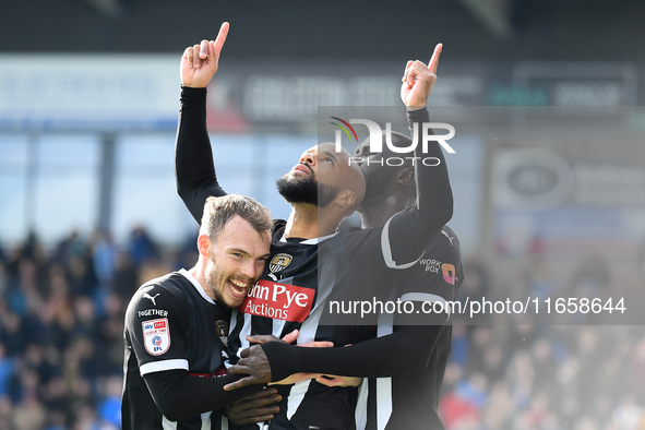 David McGoldrick of Notts County celebrates with teammates after scoring a goal to make it 2-2 during the Sky Bet League 2 match between Che...