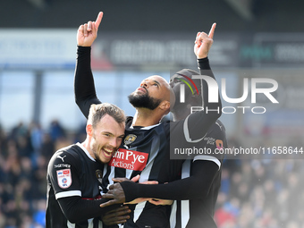 David McGoldrick of Notts County celebrates with teammates after scoring a goal to make it 2-2 during the Sky Bet League 2 match between Che...