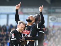 David McGoldrick of Notts County celebrates with teammates after scoring a goal to make it 2-2 during the Sky Bet League 2 match between Che...