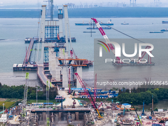 A photo taken on October 12, 2024, shows the construction site of the south main tower of the Zhangjinggao Yangtze River Bridge in Zhangjiag...