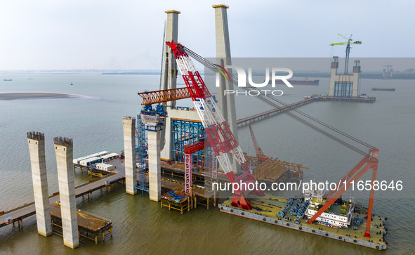 A photo taken on October 12, 2024, shows the construction site of the south main tower of the Zhangjinggao Yangtze River Bridge in Zhangjiag...