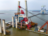 A photo taken on October 12, 2024, shows the construction site of the south main tower of the Zhangjinggao Yangtze River Bridge in Zhangjiag...