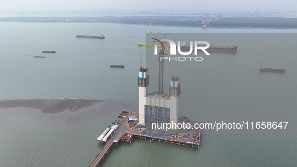 A photo taken on October 12, 2024, shows the construction site of the south main tower of the Zhangjinggao Yangtze River Bridge in Zhangjiag...