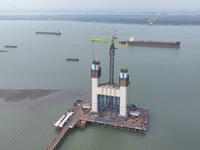 A photo taken on October 12, 2024, shows the construction site of the south main tower of the Zhangjinggao Yangtze River Bridge in Zhangjiag...