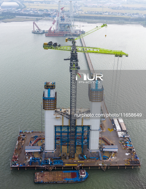 A photo taken on October 12, 2024, shows the construction site of the south main tower of the Zhangjinggao Yangtze River Bridge in Zhangjiag...