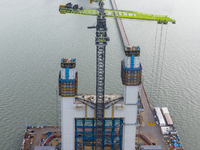 A photo taken on October 12, 2024, shows the construction site of the south main tower of the Zhangjinggao Yangtze River Bridge in Zhangjiag...