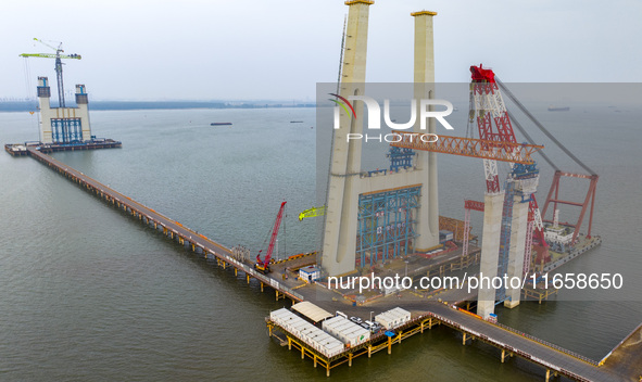 A photo taken on October 12, 2024, shows the construction site of the south main tower of the Zhangjinggao Yangtze River Bridge in Zhangjiag...