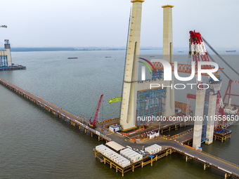 A photo taken on October 12, 2024, shows the construction site of the south main tower of the Zhangjinggao Yangtze River Bridge in Zhangjiag...