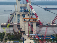 A photo taken on October 12, 2024, shows the construction site of the south main tower of the Zhangjinggao Yangtze River Bridge in Zhangjiag...