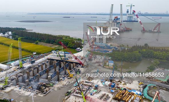 A photo taken on October 12, 2024, shows the construction site of the south main tower of the Zhangjinggao Yangtze River Bridge in Zhangjiag...