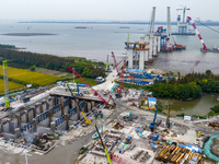 A photo taken on October 12, 2024, shows the construction site of the south main tower of the Zhangjinggao Yangtze River Bridge in Zhangjiag...