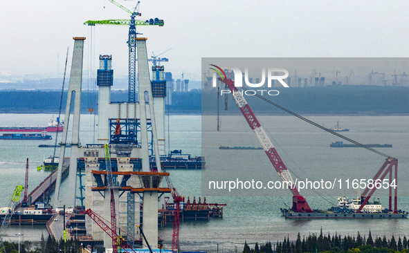 A photo taken on October 12, 2024, shows the construction site of the south main tower of the Zhangjinggao Yangtze River Bridge in Zhangjiag...