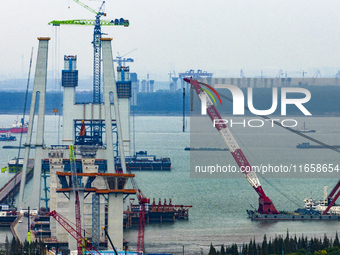 A photo taken on October 12, 2024, shows the construction site of the south main tower of the Zhangjinggao Yangtze River Bridge in Zhangjiag...