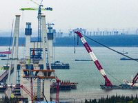 A photo taken on October 12, 2024, shows the construction site of the south main tower of the Zhangjinggao Yangtze River Bridge in Zhangjiag...