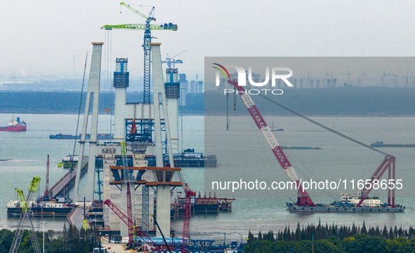 A photo taken on October 12, 2024, shows the construction site of the south main tower of the Zhangjinggao Yangtze River Bridge in Zhangjiag...