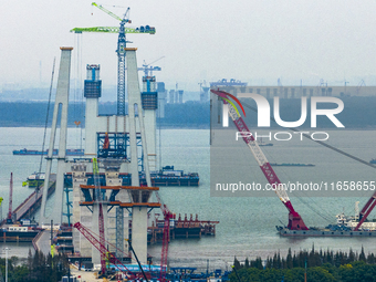 A photo taken on October 12, 2024, shows the construction site of the south main tower of the Zhangjinggao Yangtze River Bridge in Zhangjiag...