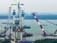 A photo taken on October 12, 2024, shows the construction site of the south main tower of the Zhangjinggao Yangtze River Bridge in Zhangjiag...