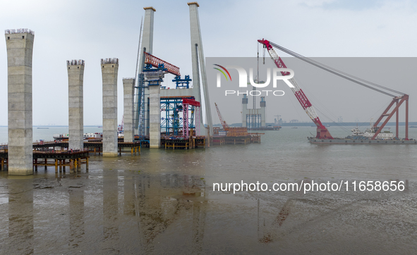 A photo taken on October 12, 2024, shows the construction site of the south main tower of the Zhangjinggao Yangtze River Bridge in Zhangjiag...