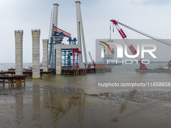 A photo taken on October 12, 2024, shows the construction site of the south main tower of the Zhangjinggao Yangtze River Bridge in Zhangjiag...