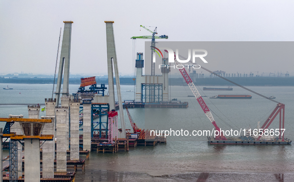 A photo taken on October 12, 2024, shows the construction site of the south main tower of the Zhangjinggao Yangtze River Bridge in Zhangjiag...