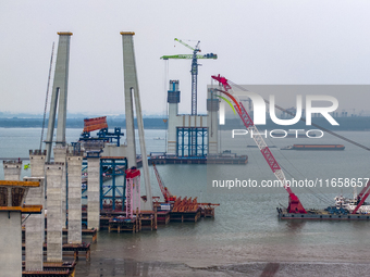 A photo taken on October 12, 2024, shows the construction site of the south main tower of the Zhangjinggao Yangtze River Bridge in Zhangjiag...