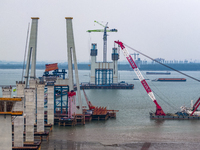 A photo taken on October 12, 2024, shows the construction site of the south main tower of the Zhangjinggao Yangtze River Bridge in Zhangjiag...