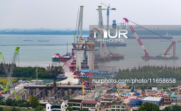 A photo taken on October 12, 2024, shows the construction site of the south main tower of the Zhangjinggao Yangtze River Bridge in Zhangjiag...