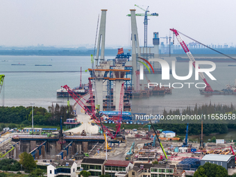 A photo taken on October 12, 2024, shows the construction site of the south main tower of the Zhangjinggao Yangtze River Bridge in Zhangjiag...