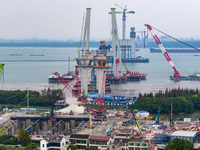 A photo taken on October 12, 2024, shows the construction site of the south main tower of the Zhangjinggao Yangtze River Bridge in Zhangjiag...