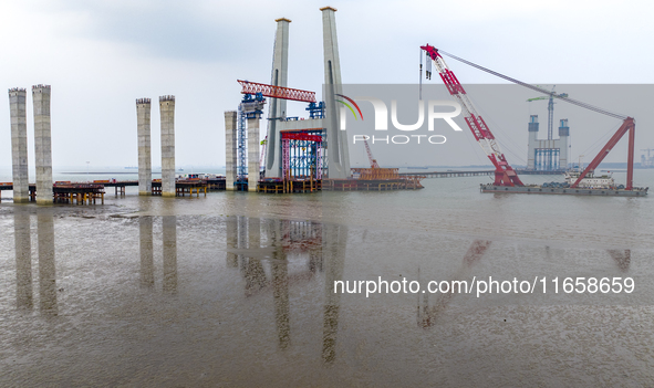 A photo taken on October 12, 2024, shows the construction site of the south main tower of the Zhangjinggao Yangtze River Bridge in Zhangjiag...