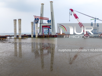 A photo taken on October 12, 2024, shows the construction site of the south main tower of the Zhangjinggao Yangtze River Bridge in Zhangjiag...