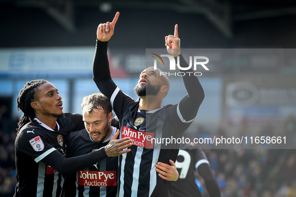 David McGoldrick of Notts County celebrates with teammates after scoring a goal to make it 2-2 during the Sky Bet League 2 match between Che...