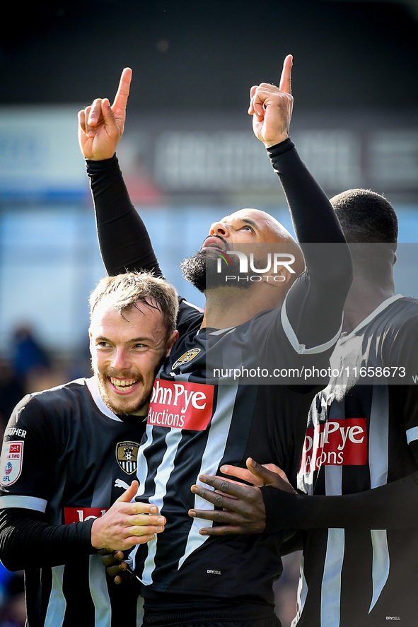 David McGoldrick of Notts County celebrates with teammates after scoring a goal to make it 2-2 during the Sky Bet League 2 match between Che...