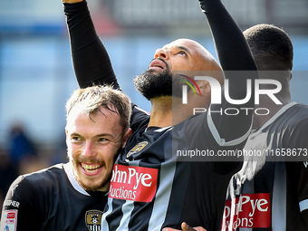 David McGoldrick of Notts County celebrates with teammates after scoring a goal to make it 2-2 during the Sky Bet League 2 match between Che...