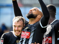 David McGoldrick of Notts County celebrates with teammates after scoring a goal to make it 2-2 during the Sky Bet League 2 match between Che...