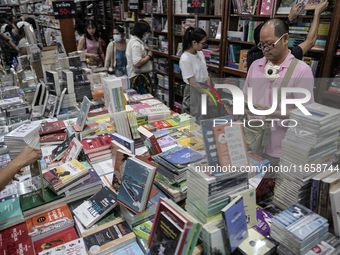 Visitors check books on display during the Book Expo Thailand 2024 in Bangkok, Thailand, on October 12, 2024. The Book Expo Thailand 2024 ta...