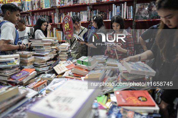 Visitors check discounted books at the Book Expo Thailand 2024 in Bangkok, Thailand, on October 12, 2024. The Book Expo Thailand 2024 takes...