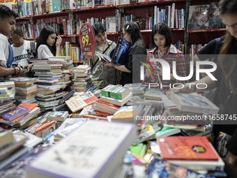 Visitors check discounted books at the Book Expo Thailand 2024 in Bangkok, Thailand, on October 12, 2024. The Book Expo Thailand 2024 takes...