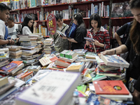 Visitors check discounted books at the Book Expo Thailand 2024 in Bangkok, Thailand, on October 12, 2024. The Book Expo Thailand 2024 takes...